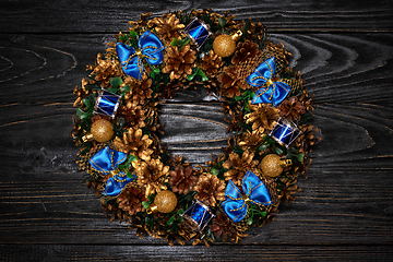 Image showing Christmas wreath on wooden background