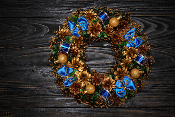 Image showing Christmas wreath on wooden background