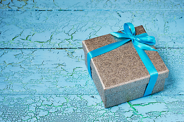 Image showing Gift box with blue ribbon