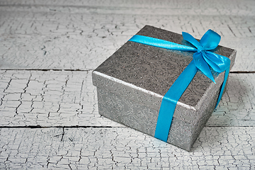 Image showing Gift box with blue ribbon