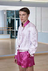 Image showing High fashion young sexy man in pink shorts and a white jacket.