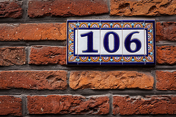 Image showing Decorated house number on brick wall in Europe. Bruges (Brugge),