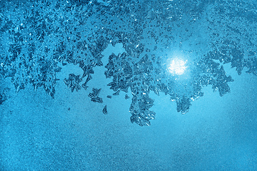 Image showing Ice pattern and sunlight on morning winter glass