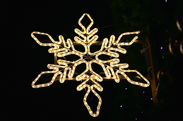 Image showing Beautiful christmas decoration, bright glowing neon snowflake