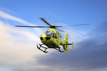 Image showing FinnHEMS Medical Helicopter Against Blue Sky with Clouds