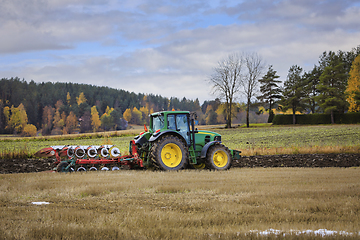 Image showing John Deere 7530 Tractor Plowing Stubble Field in Autumn