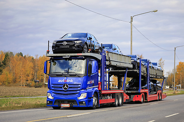 Image showing Blue Mercedes-Benz Actros Vehicle Carrier Transports New Cars