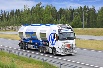 Image showing Volvo FH Truck Pulls Three Compartment Tank Trailer on Road