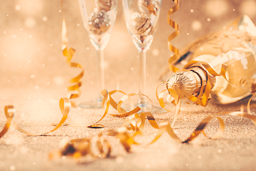 Image showing Happy New Years Eve and Christmas celebration with 2 glasses , champagne and ornaments