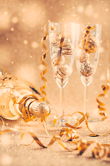 Image showing Happy New Years Eve and Christmas celebration with 2 glasses , champagne and ornaments