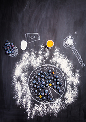 Image showing Baking concept - ingredients for blueberry pie, sprinkled wheat flour circle