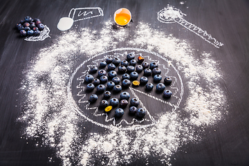 Image showing Baking concept - ingredients for blueberry pie, sprinkled wheat flour circle