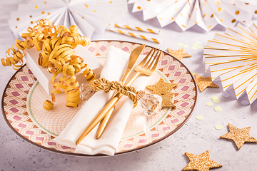 Image showing Festive place setting for Christmas and New Year with paper  fans in golden tone