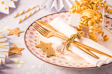 Image showing Festive place setting for Christmas and New Year with paper  fans in golden tone