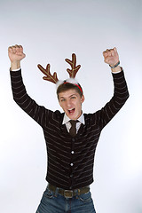 Image showing Young man wearing deer horns