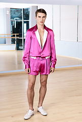 Image showing High fashion young sexy man in pink shorts and a white jacket.