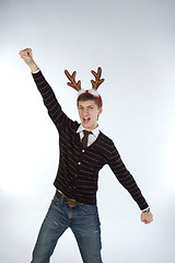 Image showing Young man wearing deer horns