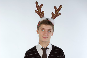 Image showing Young man wearing deer horns