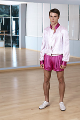Image showing High fashion young sexy man in pink shorts and a white jacket.