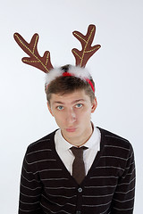 Image showing Young man wearing deer horns