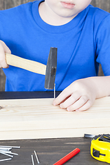 Image showing a small boy is building