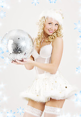 Image showing sexy santa helper with disco ball