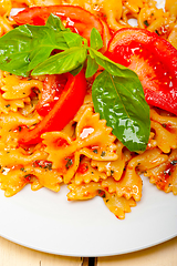 Image showing Italian pasta farfalle butterfly bow-tie and tomato sauce