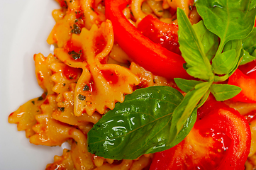 Image showing Italian pasta farfalle butterfly bow-tie and tomato sauce