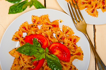 Image showing Italian pasta farfalle butterfly bow-tie and tomato sauce