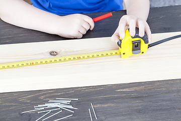 Image showing a small boy is building