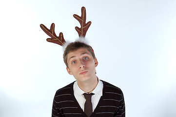 Image showing Young man wearing deer horns