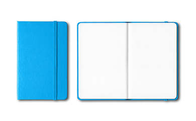 Image showing Cyan blue closed and open notebooks isolated on white