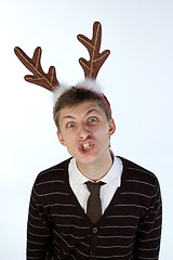 Image showing Young man wearing deer horns