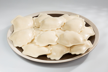 Image showing Vareniki or dumplings, pierogi before boiling - traditional Ukrainian food