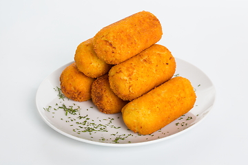 Image showing A plate of fried cheese mozzarella cheese sticks