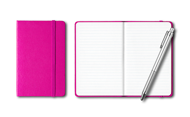 Image showing Pink closed and open notebooks with a pen isolated on white