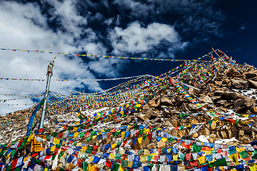 Image showing Tibetan Buddhist prayer flags on top of Khardung La pass. Highest motorable pass in the world 5602 m