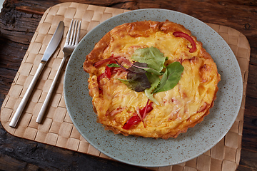 Image showing Omelet with green onion on wood table. Fresh ingredient of egg and onion. Delicious dish. Easy to cook. Popular in Thailand food. Still life food.