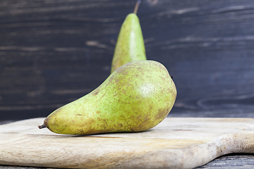 Image showing two old green pears