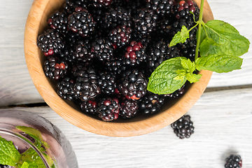 Image showing Wooden cup with Blackberries