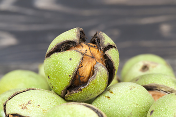 Image showing cracked ripened walnuts