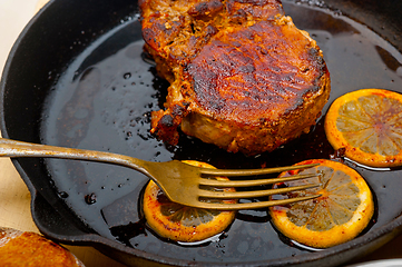 Image showing pork chop seared on iron skillet