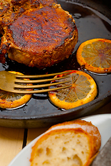 Image showing pork chop seared on iron skillet