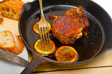 Image showing pork chop seared on iron skillet