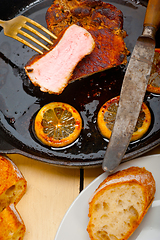 Image showing pork chop seared on iron skillet