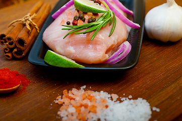 Image showing fresh organic chicken breast with herbs and spices