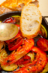 Image showing roasted shrimps with zucchini and tomatoes