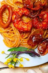 Image showing Italian seafood spaghetti pasta on red tomato sauce