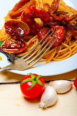 Image showing Italian seafood spaghetti pasta on red tomato sauce