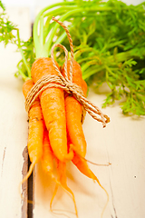 Image showing baby carrots bunch tied with rope